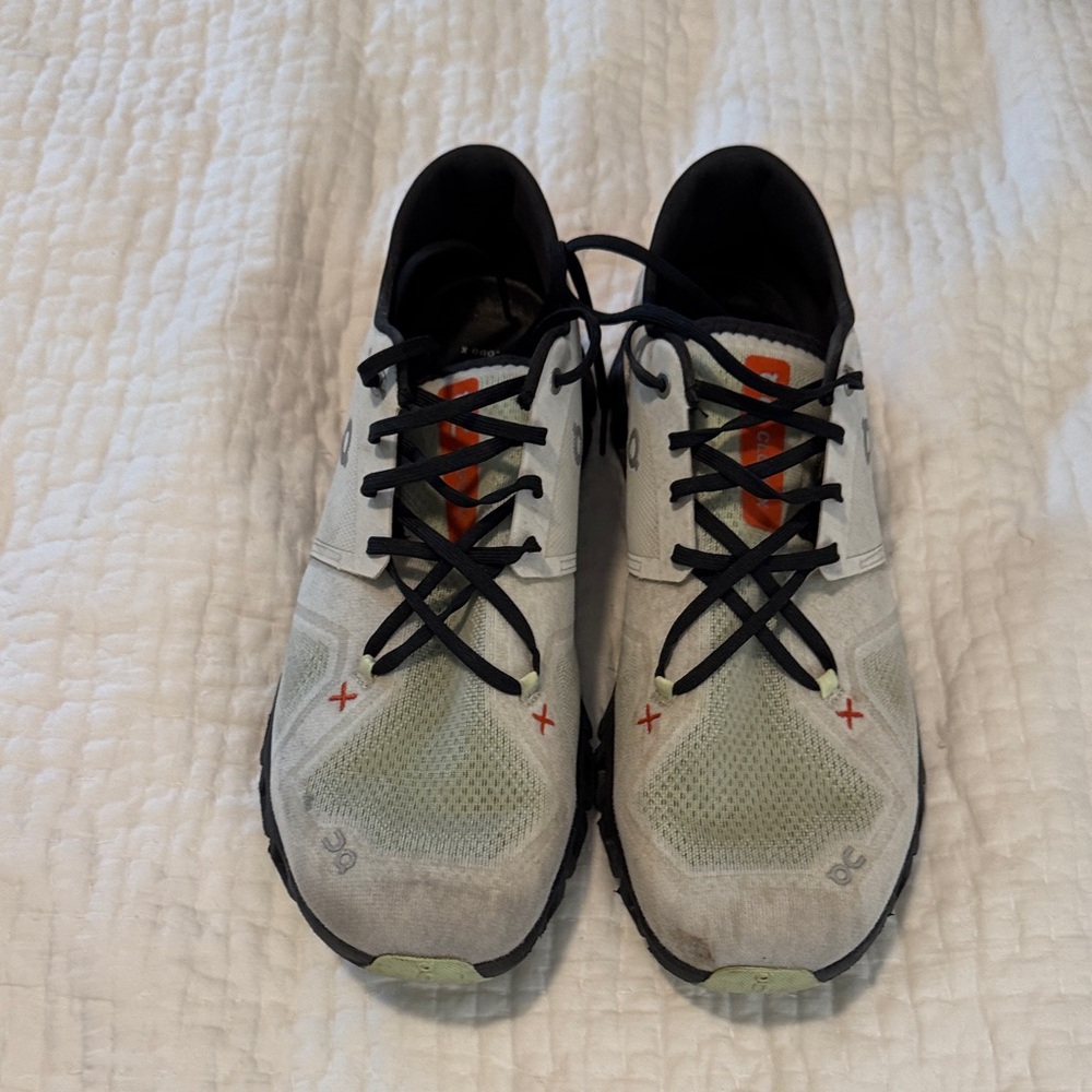 DC Men's white and Black Athletic Shoes with Orange Accents.